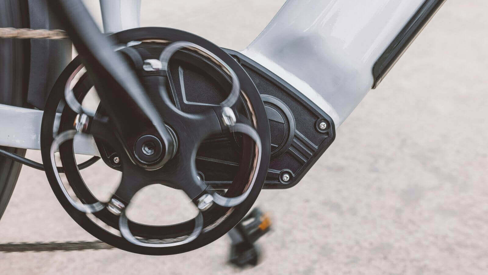 mid-drive electric motor installed on mountain e-bike with crankset view