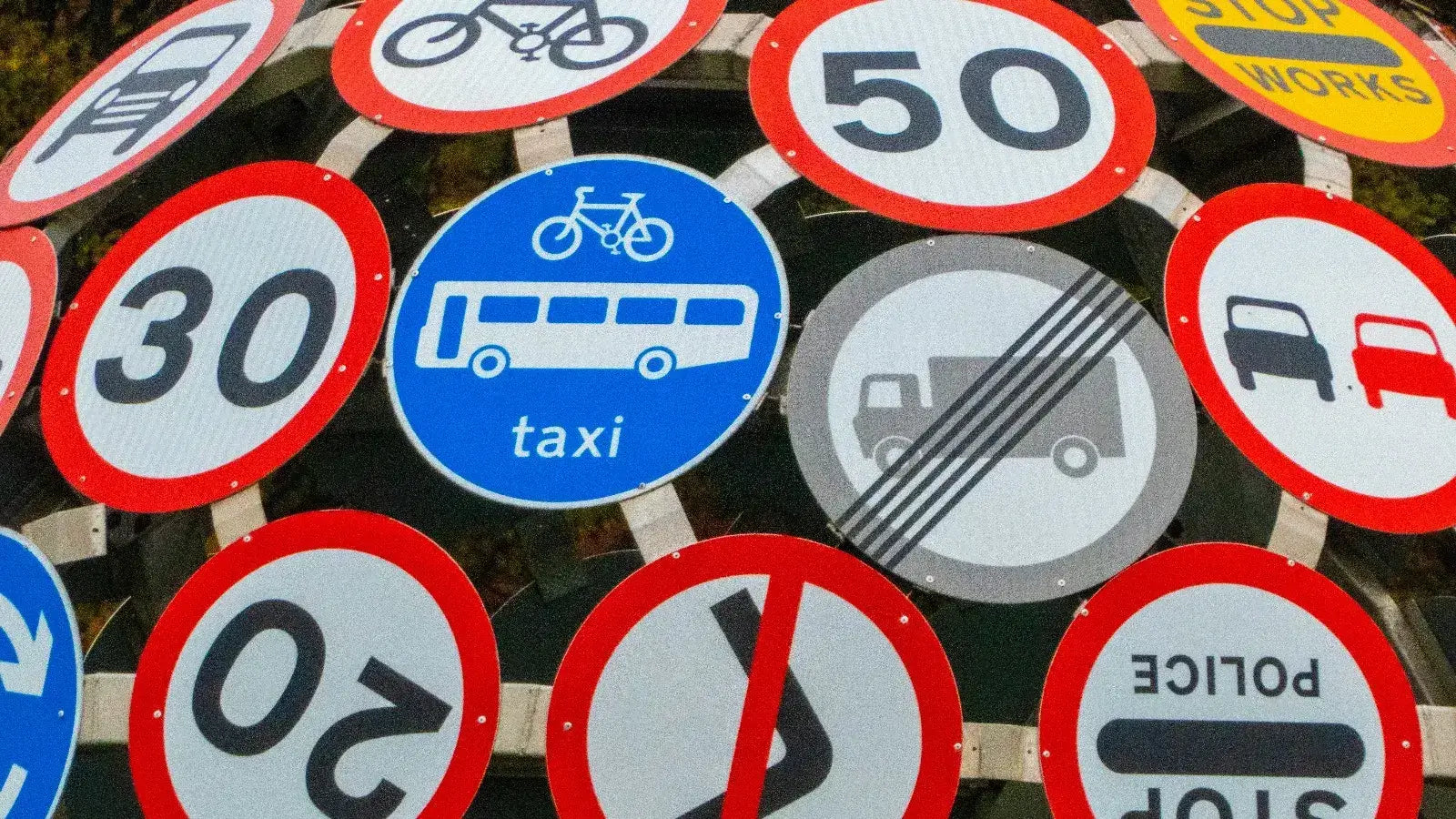 Various traffic signs indicating road speed limits and vehicle restrictions for high-speed electric bikes