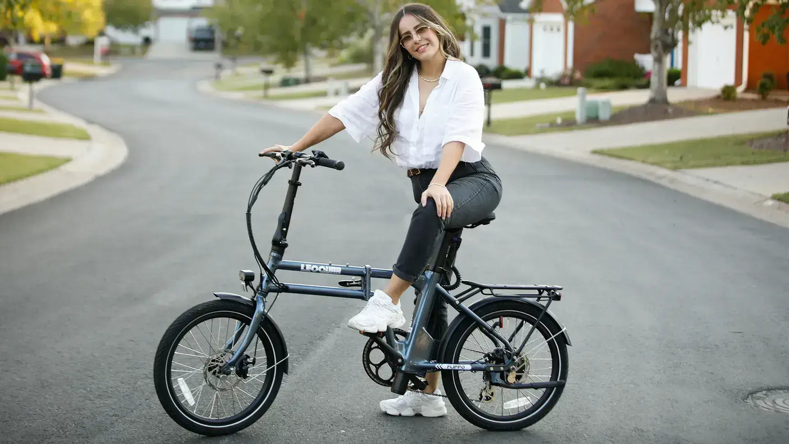 Woman riding a lightweight folding ebike in the city