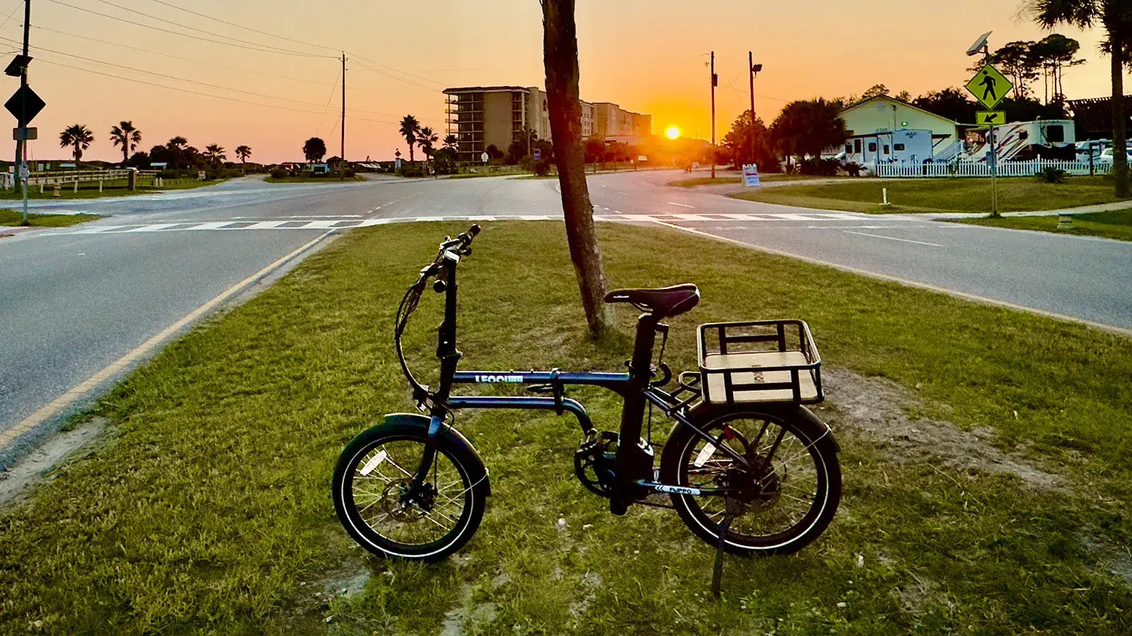 Black electric bike with rear rack for cargo and storage solutions