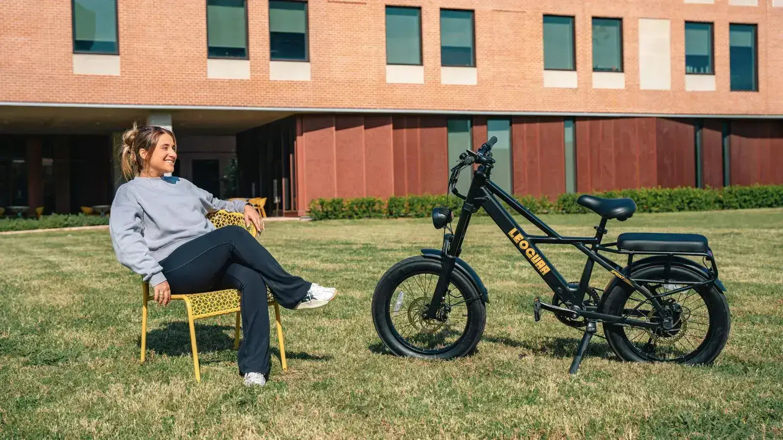 Man sitting near a 2 person electric bike designed for relaxed outdoor adventures