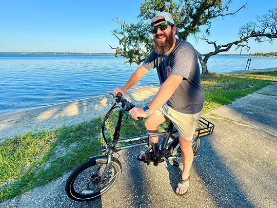 Man riding ebike by the sea