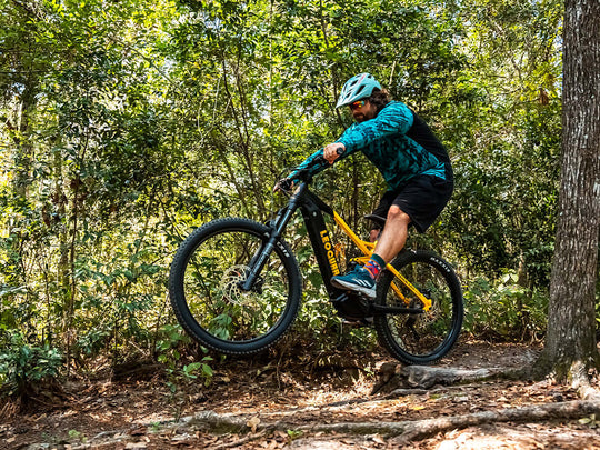 Rider trail-riding full suspension mountain ebike