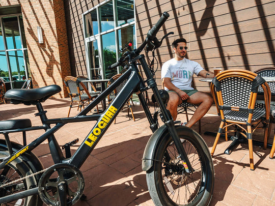Man sitting by fat tire utility ebike