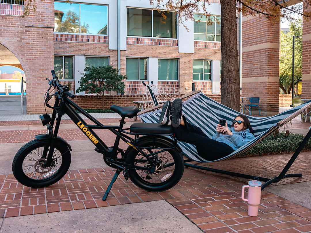 Woman relaxing near fat tire ebike
